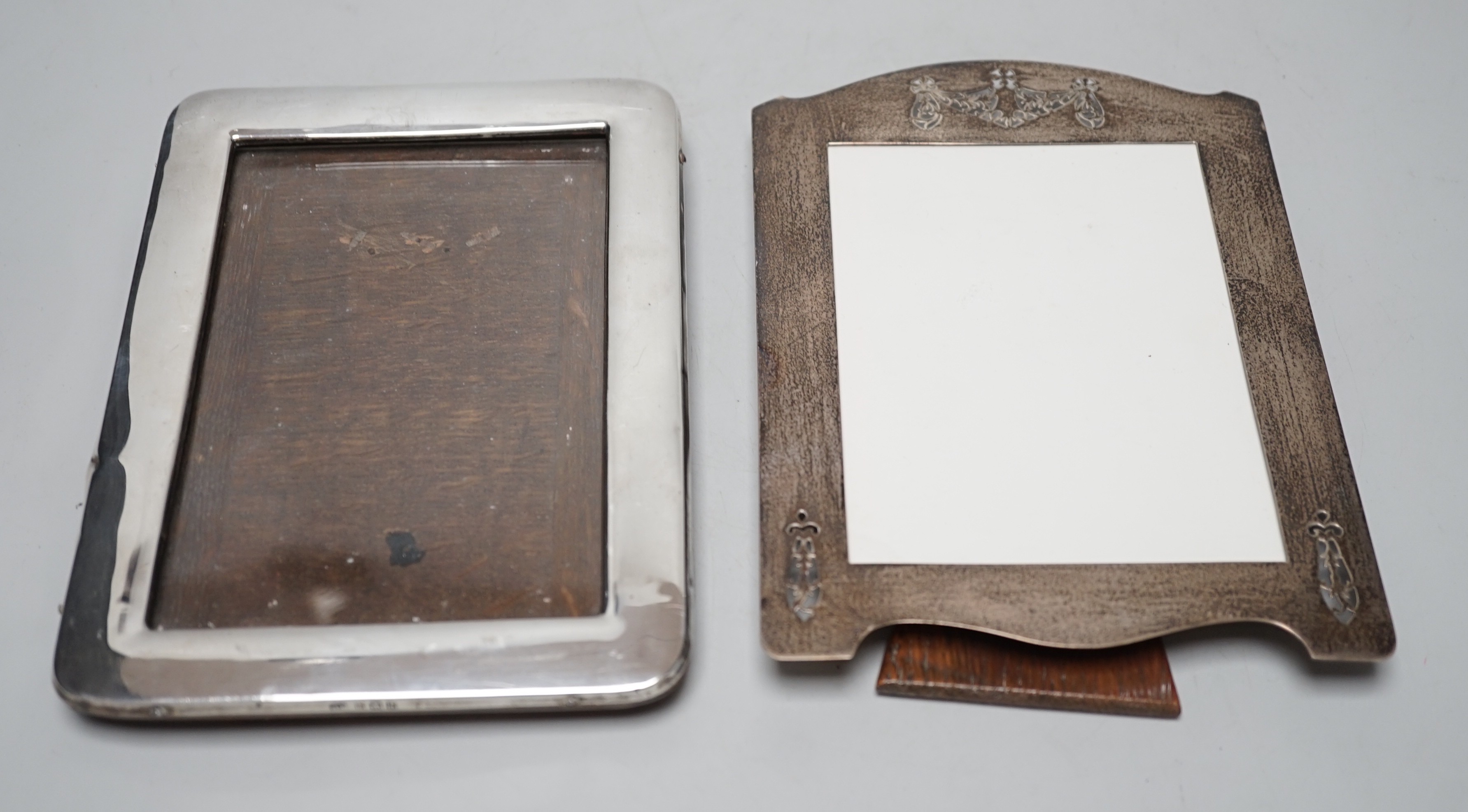 A George V pierced silver mounted photograph frame, W & F Rabone, Birmingham, 1912, 19cm and one other Edwardian silver mounted photograph frame.